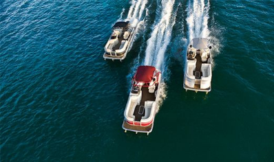 Three pontoon boats